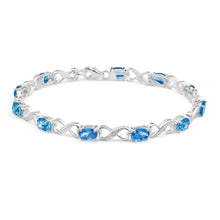 Load image into Gallery viewer, Sterling Silver Blue Cubic Zirconia + Diamond Bracelet