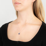 Sterling Silver Rhodium Plated Oval Synthetic Spinel Cubic Zirconia Crossover Pendant