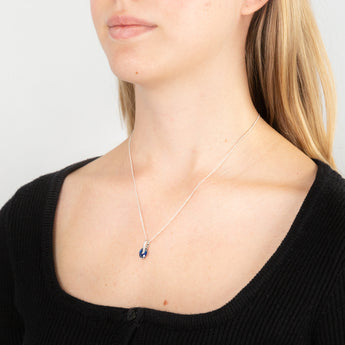 Sterling Silver Rhodium Plated Oval Synthetic Spinel Cubic Zirconia Crossover Pendant